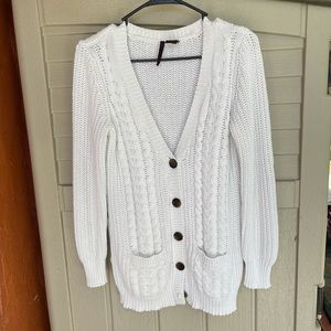 Cream colored cardigan with suede elbow details